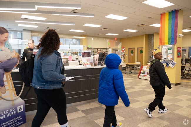 Mont Pleasant's library branch is a new building with EV chargers in the parking lot.