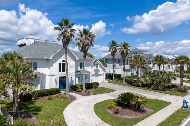 A beautiful two-story home with a large driveway in Ponte Vedra Beach.