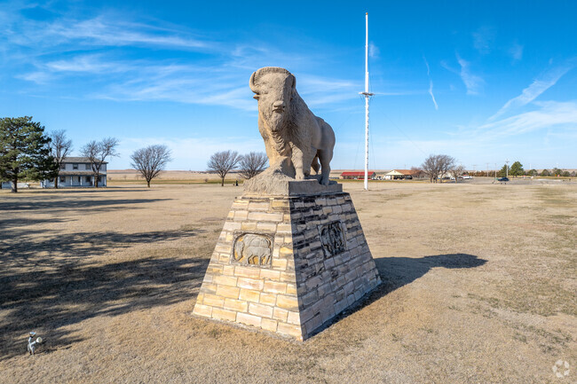 This stone statue stands outside the Old Fort Hays Historic Site.