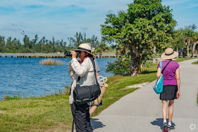 Bird photographers flock to Lakes Park for nature photographs.