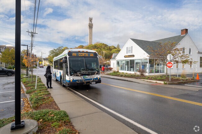 CCRTA bus serves Provincetown streets with Pilgrim Monument in view.