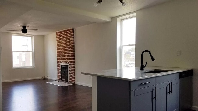 Great Room Looking Towards the Kitchen and Antique Fireplace