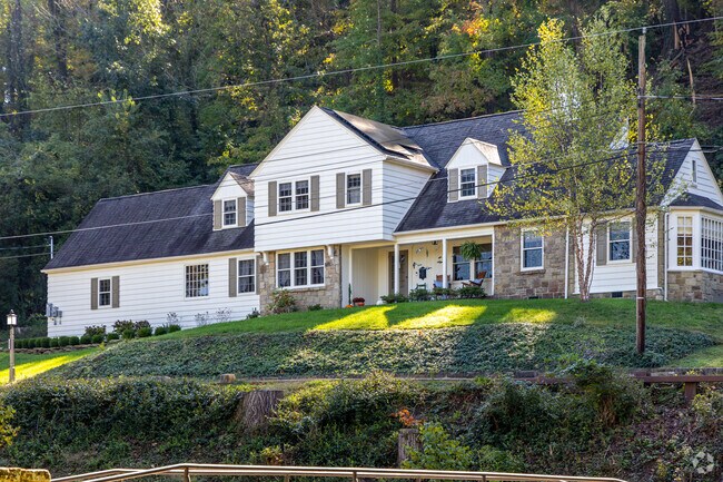 A large home sits up on the hillside in the Southern Hills neighborhood of Huntington, WV.