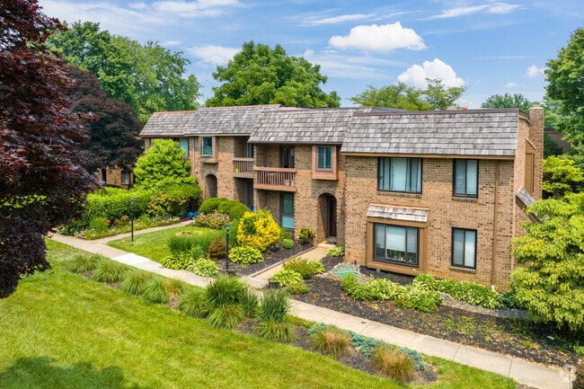 The homes in Harper's Choice have lush green grass.