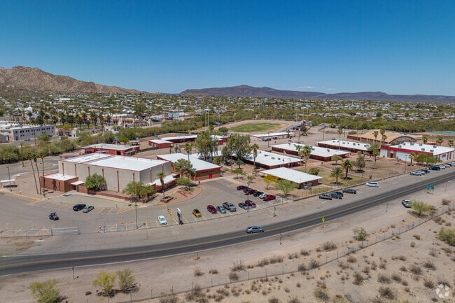 The shared campus of Ajo's schools includes parking, drop-off zones, and access roads that wind through the desert landscape.
