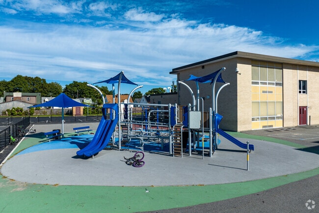 Students enjoy the playground at Fallon Memorial School in Darlington.