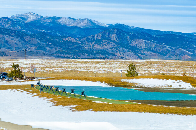 Practice your swing at Berthoud’s TPC Golf Course, which has mountain views.