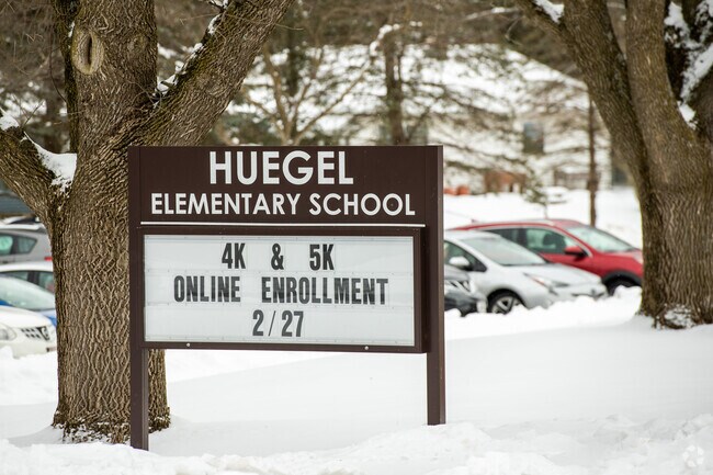 The Huegel Elementary School signage provides the daily announcements.