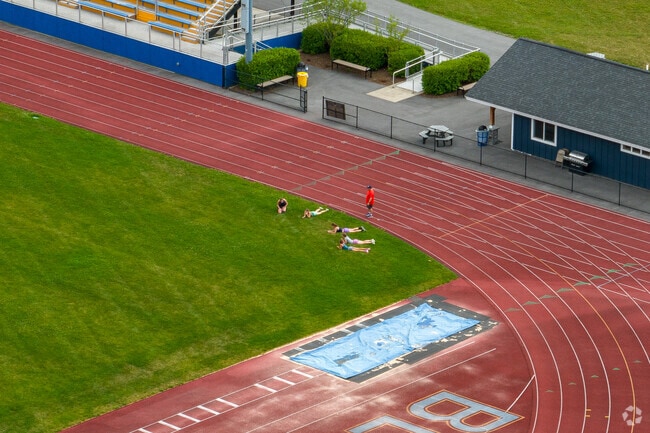 Students practice at the track of Charles O. Dickerson High School.