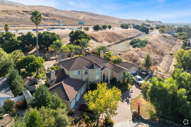 These hillside homes feature unique architecture adapted to the terrain.