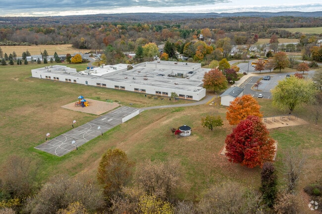Patrick McGaheran School features a playground, basketball courts, and a baseball field.