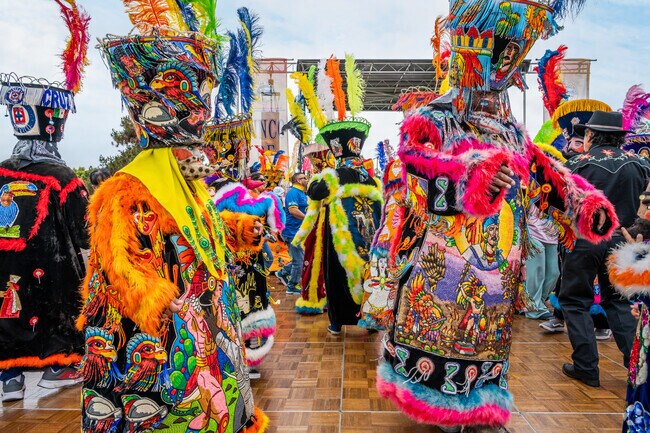 Chinelos, or traditional costumed dancers, are vibrant during the Cinco De Mayo Fiesta.