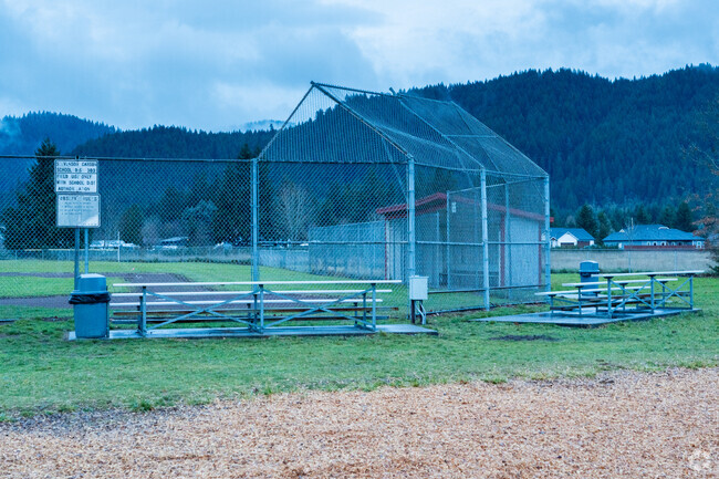 A baseball field and bleachers for students to enjoy.