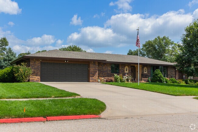 Brick ranch-style homes with long driveways and flagpoles are common in Seward.