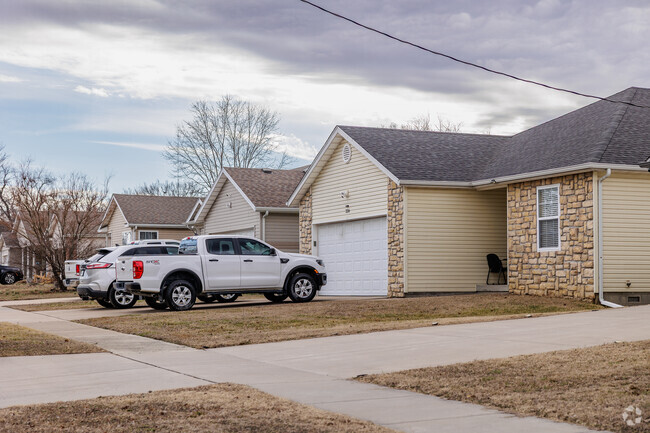 Newer homes line a residential street in Chitwood.