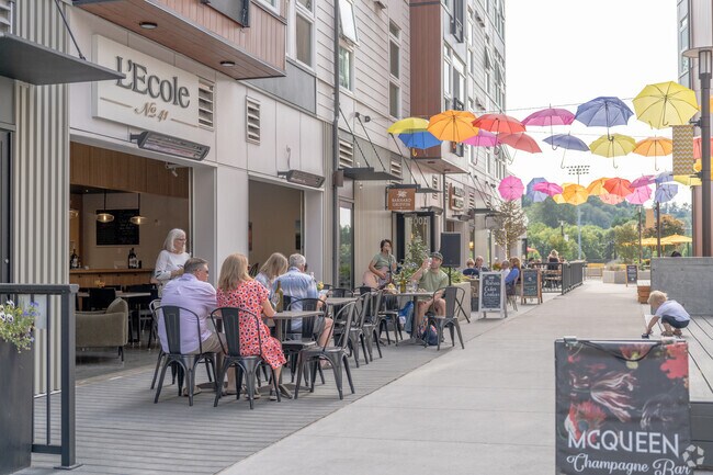 Locals from English Hill enjoy live music and wine tasting in Downtown Woodinville.