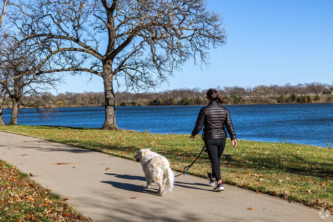 Locals take brisk walks around Lake Shawnee with their best friend.