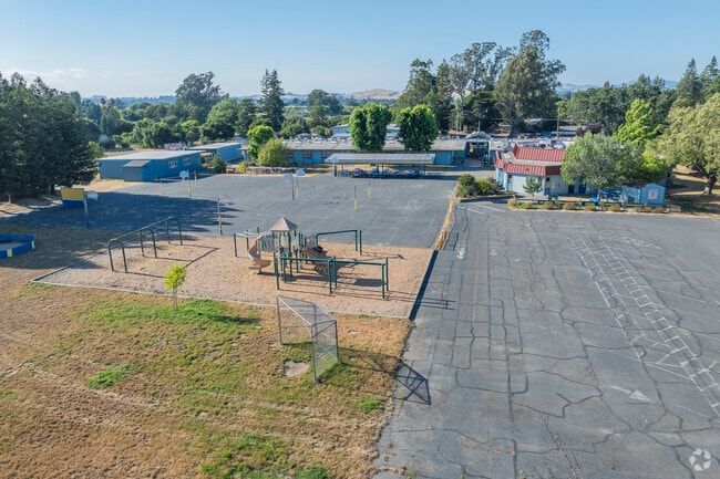 Wilson Elementary School has a large blacktop and play structure.