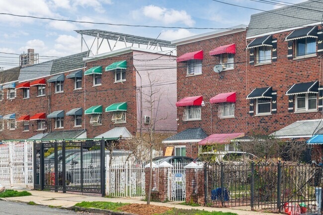 Neighborhood streets along Castle Hill Avenue feature rows of brick homes with colorful awnings.