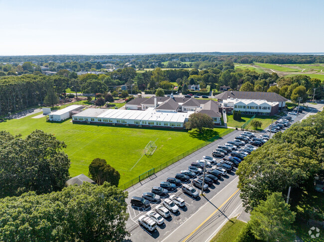 Tuckahoe School parking lot is next to the soccer field in the back of the school.