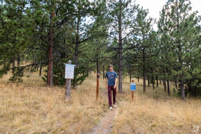A man smiles after enjoying his hike to Mount Ascension from the Bompart Hill Trailhead.