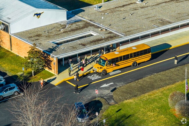 Buses pick up students at the end of the day at John P. Oldham Elementary School in Norwood, MA.