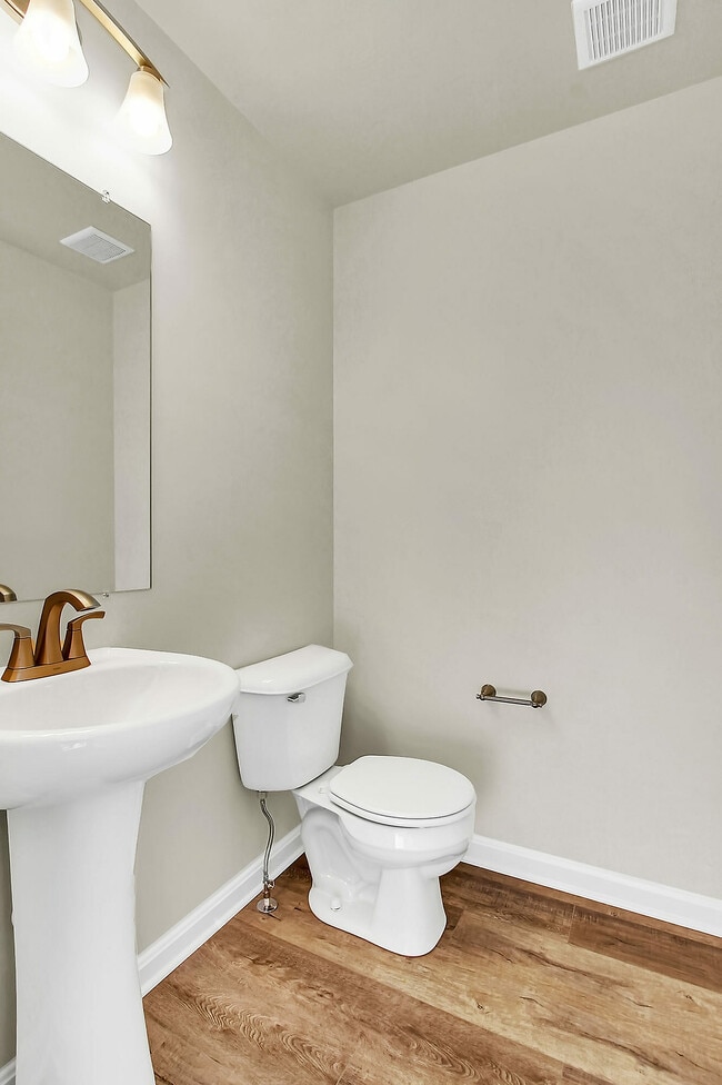 Experience tranquility in this elegantly designed bathroom, where modern elements meet comfort.