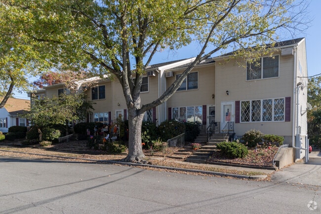 A row of condos sits under the shade in Beverage Hill.