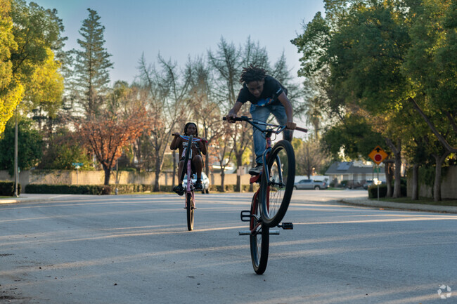 Teens riding bikes home from Haggin Oaks Park.