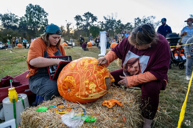 Sculptors at The Great Pumpkin Carve put the finishing touches on their latest work.