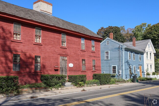 Older Federal style house sit in a colorful row in Ipswich.