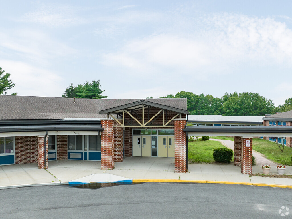 Accompsett Elementary School main entrance has schoolings for K-5 grades.