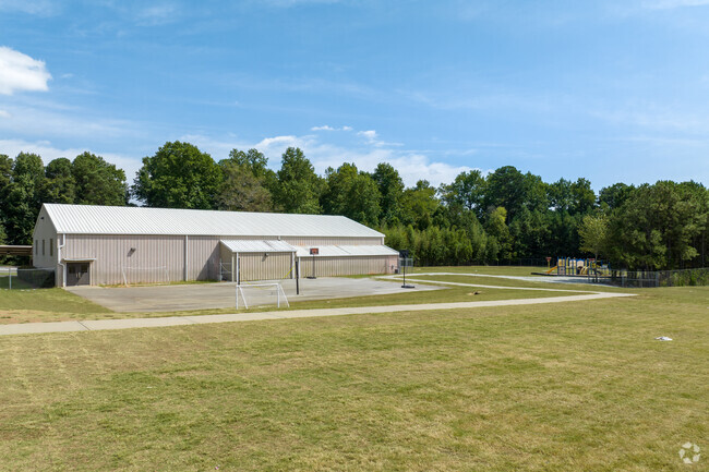 Charles Brant Chesney Elementary School has spacious green space perfect for outdoor recreation.