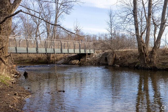 Bridges in Arthur K. Draut Park span Beargrass Creek and connect scenic trails.