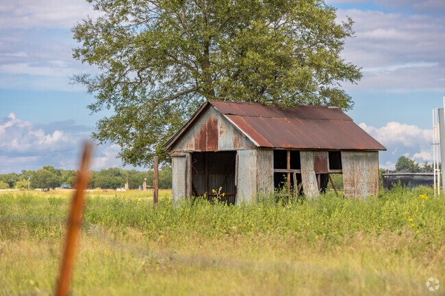A shed in a Turley, Oklahoma pasture adds a rustic touch to the serene countryside.