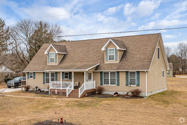 Cape Cod homes with dormer windows typically sit on large lots in Woodside.