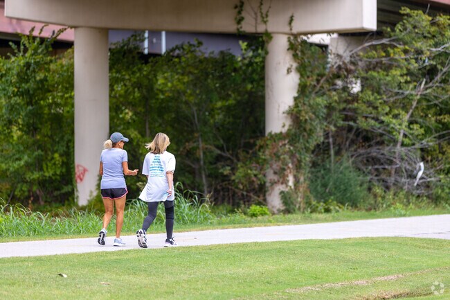 Two women taking a leisurely walk along the trail in the Rabbit Run neighborhood.