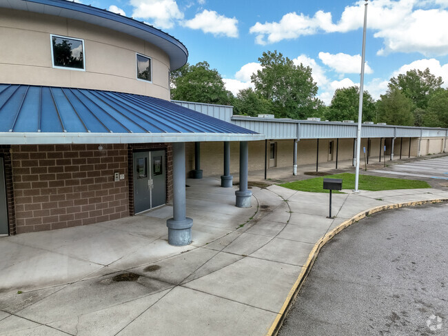 Children are protected with shade over the entrance to Bayvale Elementary School Augusta, GA.