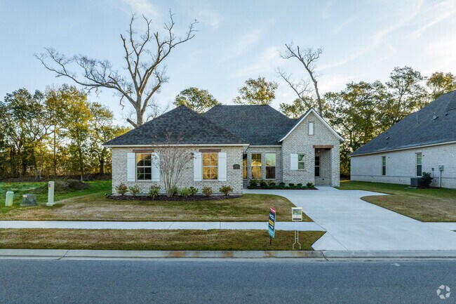 A newly built home sits beside mature trees in Darrow.