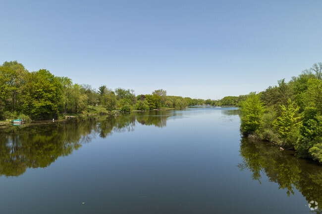 The Grand River winds along the northwestern edge of Averill Woods in Lansing, adding scenic charm to the neighborhood.
