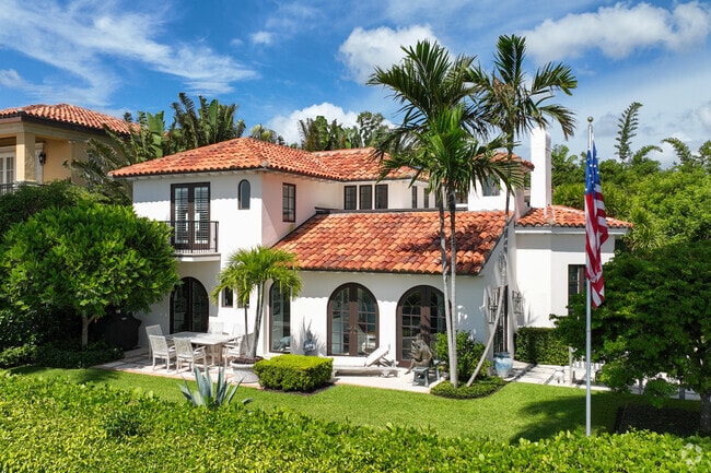 Stunning Mediterranean Revival home with exquisite landscaping in West Palm Beach.