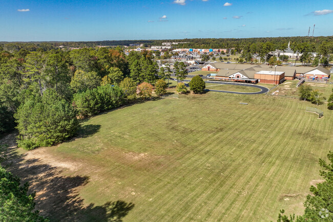Carter Elementary School has a large field next to the school for children to play on.