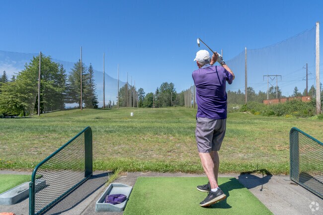 Practice your golf swing on the driving range at Gleneagle Golf Course near Sisco Heights.
