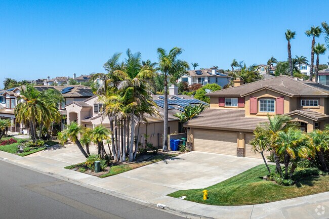 Discover spacious Spanish-style homes in Poinsettia.