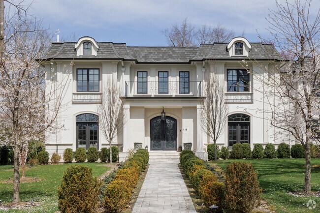 A large French Colonial style McMansion in Demarest, NJ.