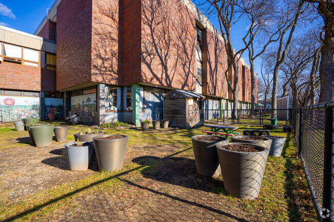 There is a designated flower potting area behind Kennedy-Longfellow School in East Cambridge.