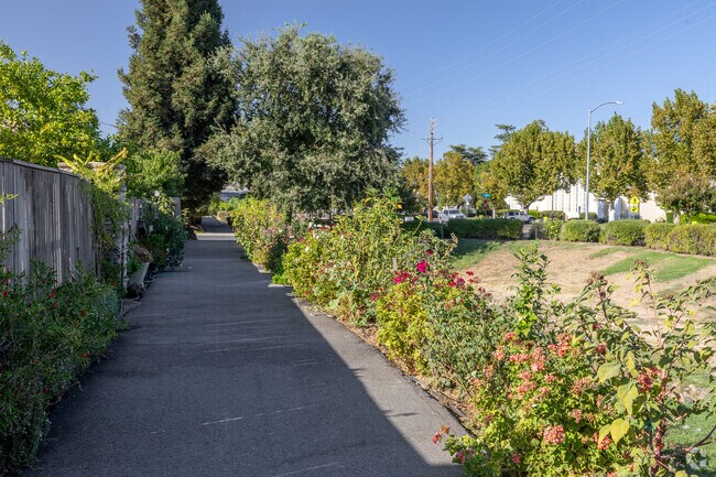 Shaded sidewalks lined with wildflowers make strolling through the neighborhood a joy.