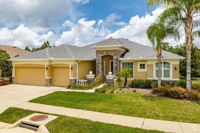 An Odessa home with timeless style, a 3 car garage, and beautiful landscaping.
