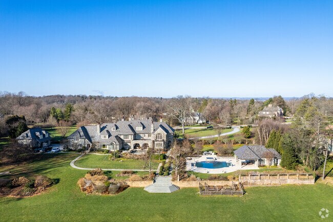 Expansive single-family estates in Bryn Mawr occupy large, landscaped lots with mature trees and private drives.