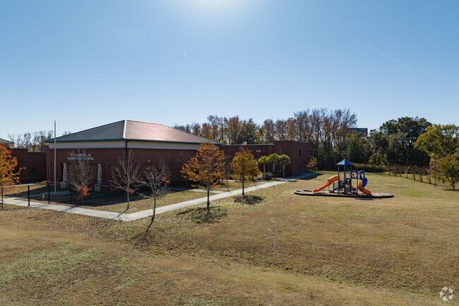 Students at Otis J. Brock Elementary School enjoy a playground.